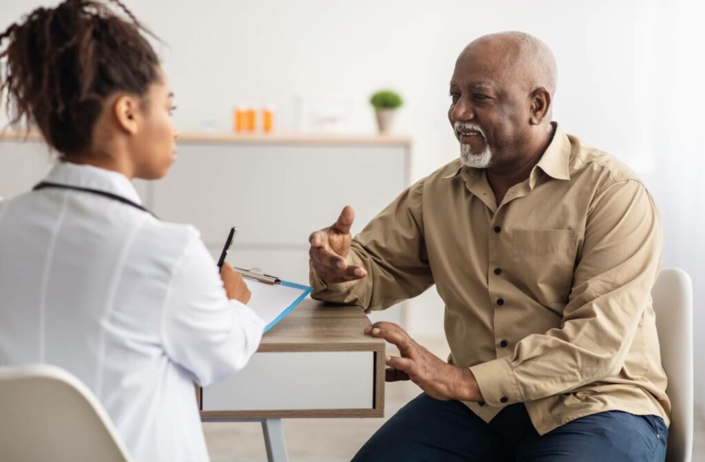 a senior man explaining his needs to a doctor for home health care