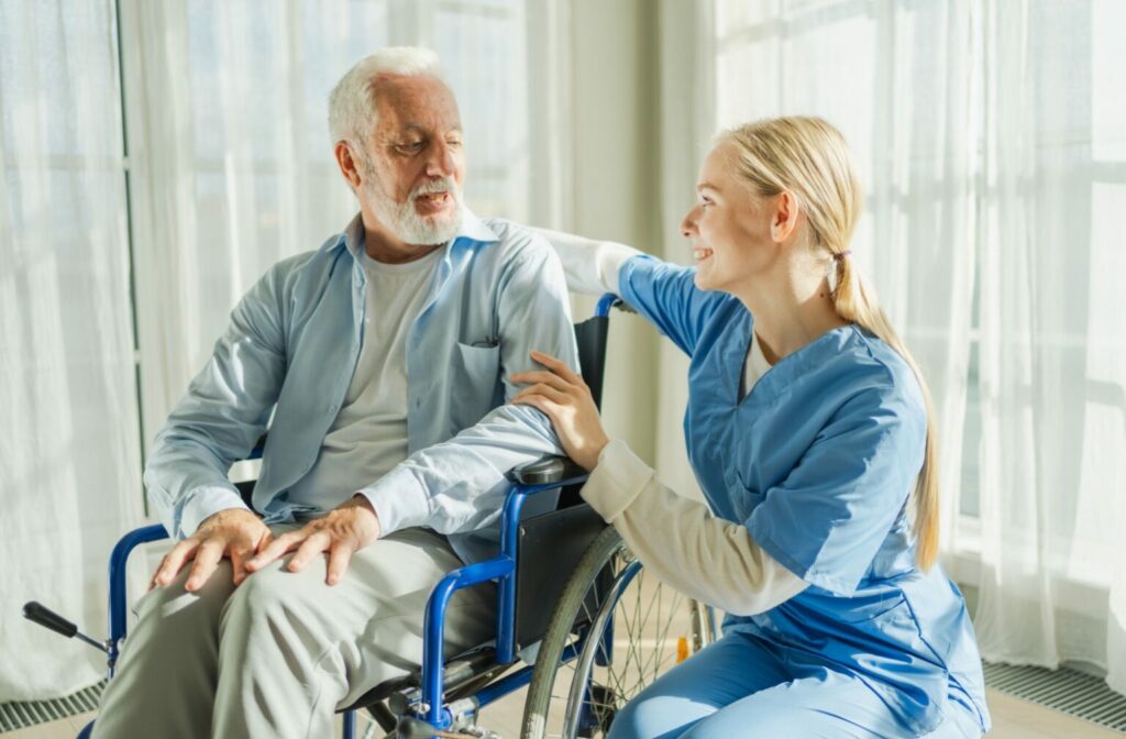 a caregiver helping a senior with wheelchair in home healthcare