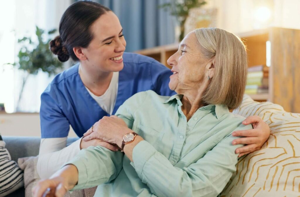 a home health nurse hugging a senior woman lovingly